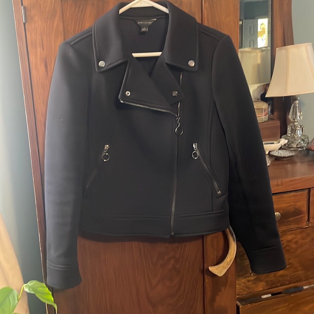 Black heavy motorcycle jacket.  Excellent condition.  Textured fabric.